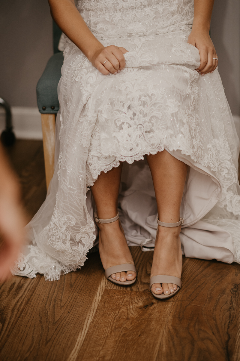 A bride getting ready for her wedding at The Anchor Inn in Pasadena, Maryland by Britney Clause Photography