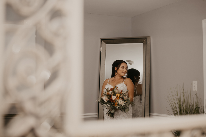 A bride getting ready for her wedding at The Anchor Inn in Pasadena, Maryland by Britney Clause Photography