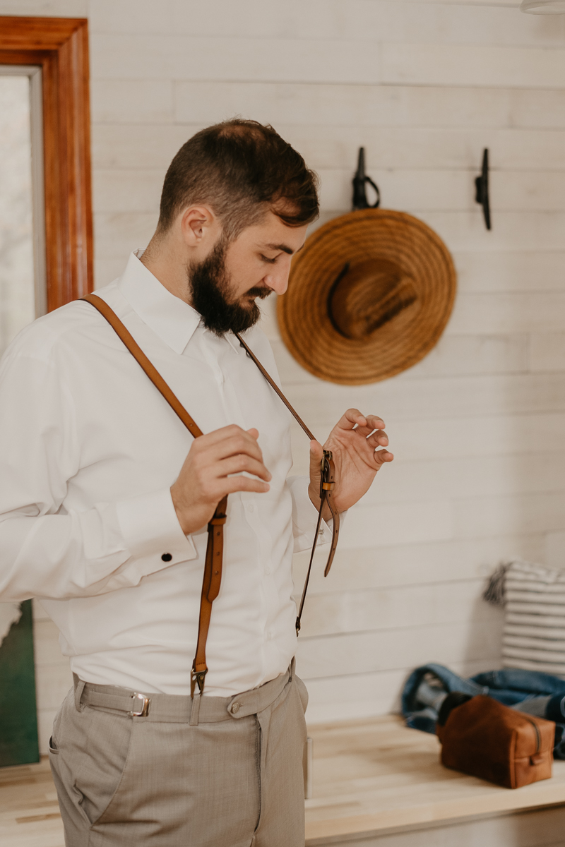 A groom getting ready for his wedding at The Anchor Inn in Pasadena, Maryland by Britney Clause Photography