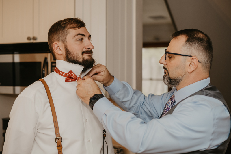 A groom getting ready for his wedding at The Anchor Inn in Pasadena, Maryland by Britney Clause Photography