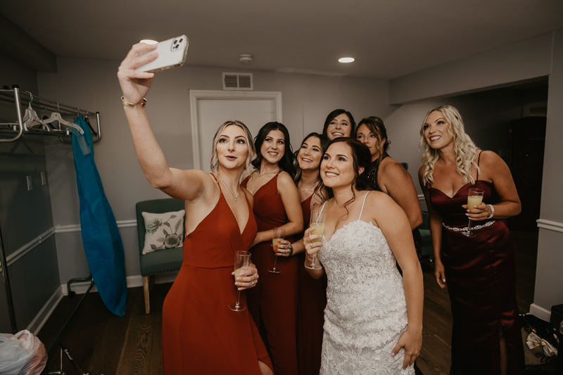 A bride getting ready for her wedding at The Anchor Inn in Pasadena, Maryland by Britney Clause Photography