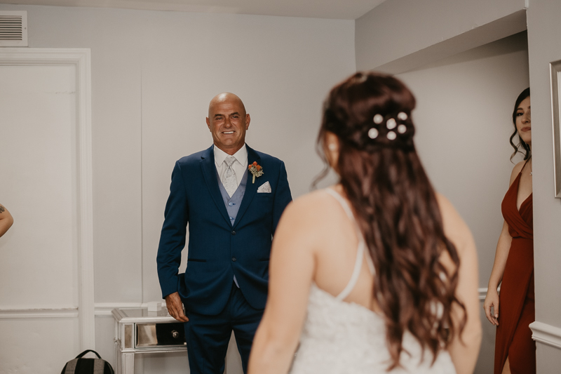 A bride getting ready for her wedding at The Anchor Inn in Pasadena, Maryland by Britney Clause Photography