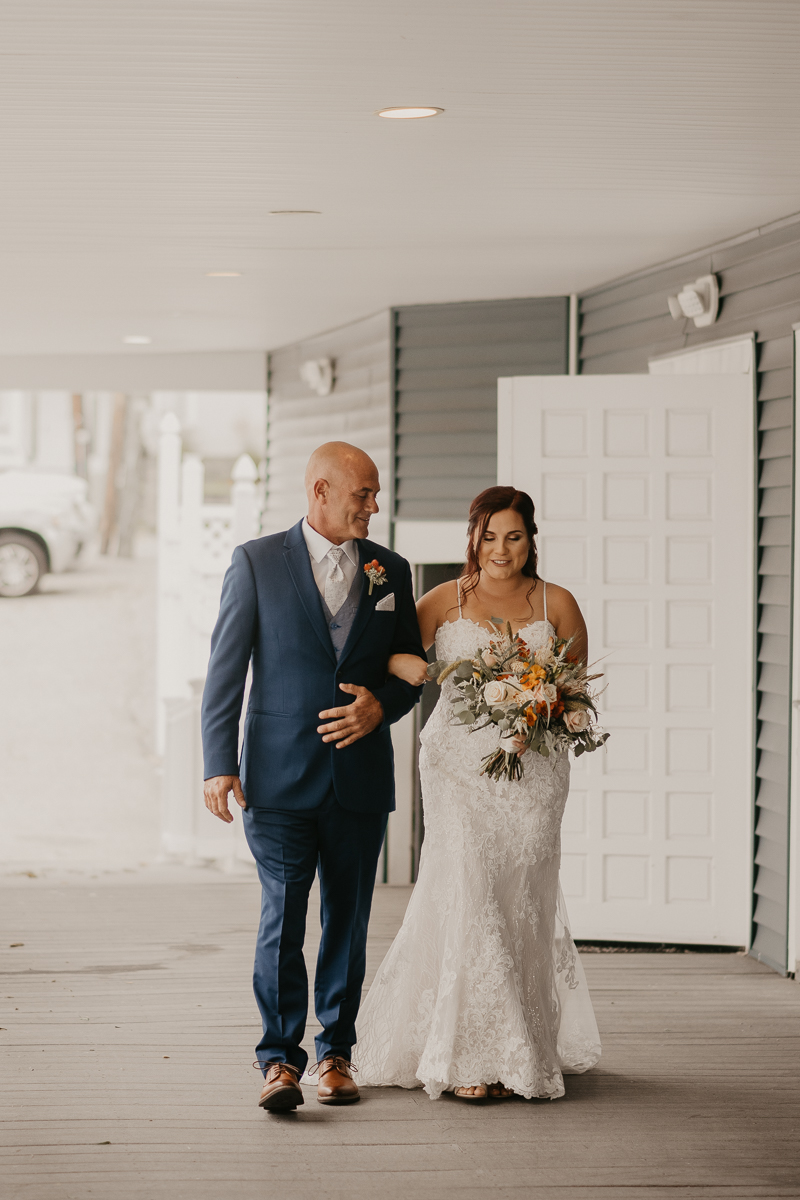 Amazing waterfront wedding ceremony at The Anchor Inn in Pasadena, Maryland by Britney Clause Photography