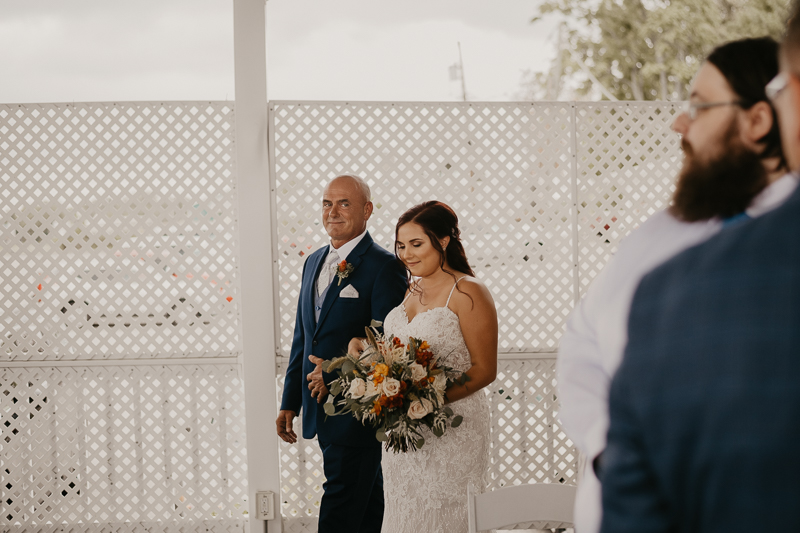 Amazing waterfront wedding ceremony at The Anchor Inn in Pasadena, Maryland by Britney Clause Photography