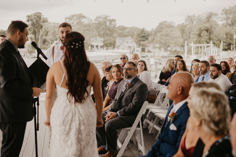 Amazing waterfront wedding ceremony at The Anchor Inn in Pasadena, Maryland by Britney Clause Photography