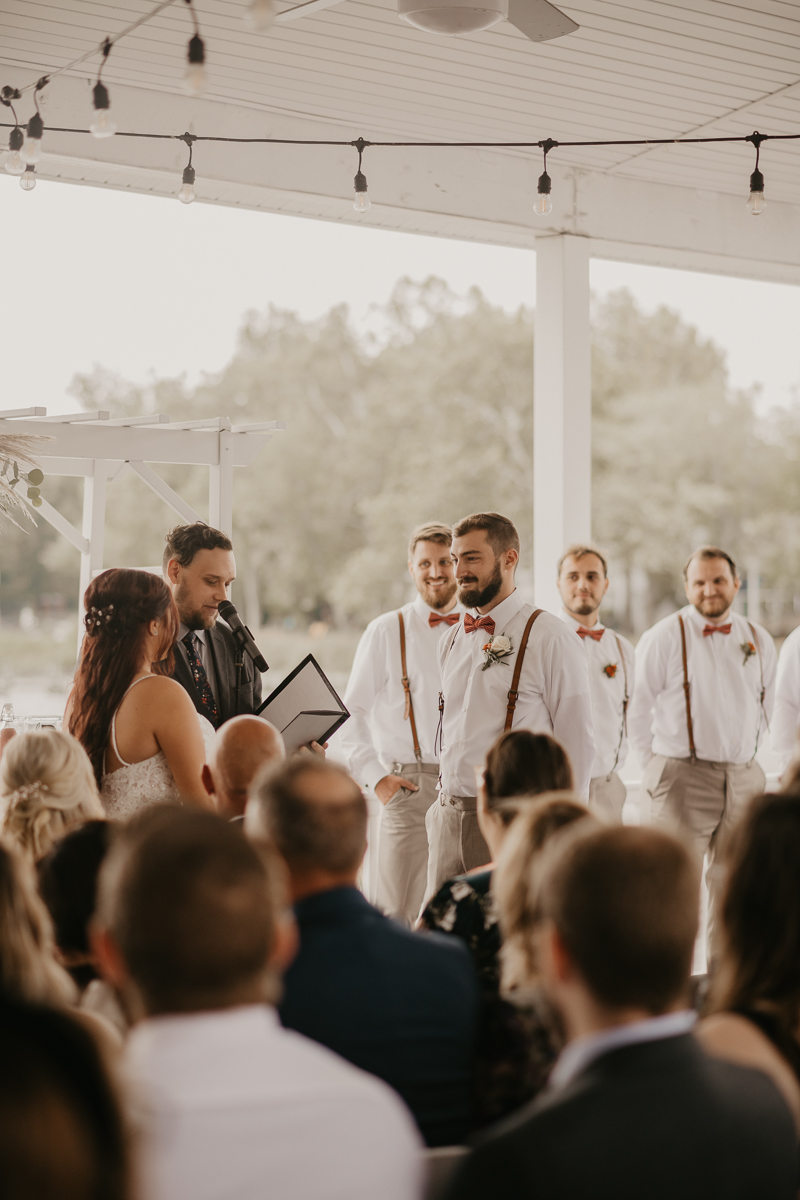 Amazing waterfront wedding ceremony at The Anchor Inn in Pasadena, Maryland by Britney Clause Photography