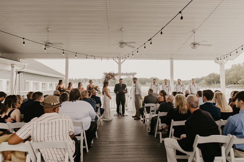 Amazing waterfront wedding ceremony at The Anchor Inn in Pasadena, Maryland by Britney Clause Photography