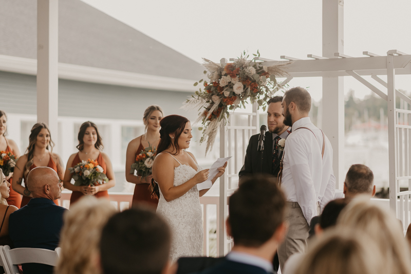 Amazing waterfront wedding ceremony at The Anchor Inn in Pasadena, Maryland by Britney Clause Photography