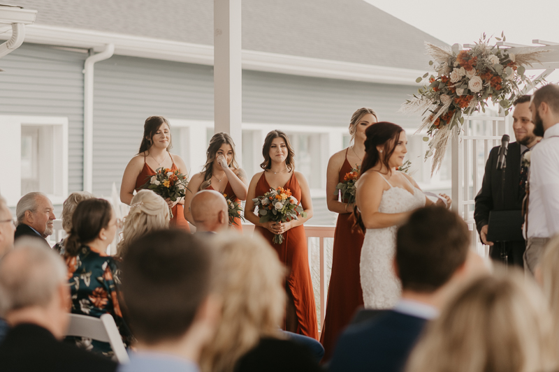 Amazing waterfront wedding ceremony at The Anchor Inn in Pasadena, Maryland by Britney Clause Photography