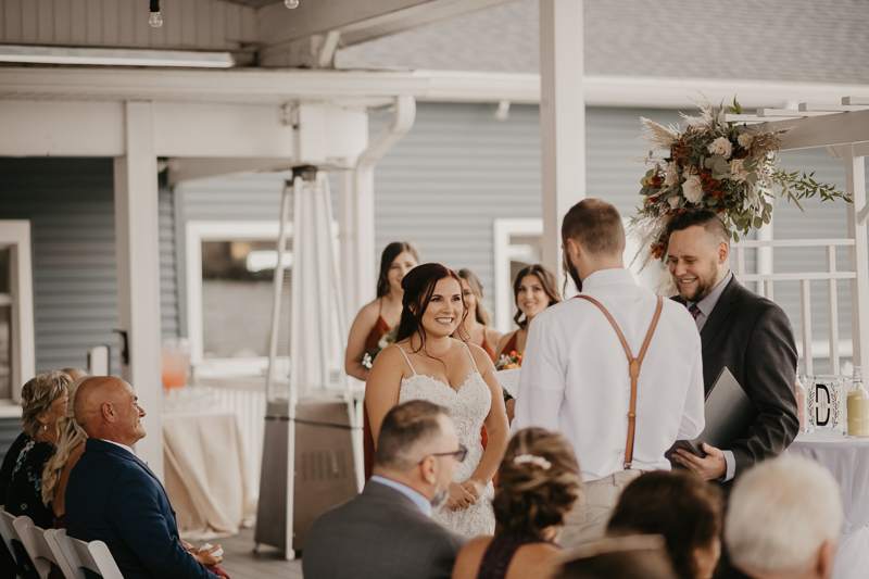 Amazing waterfront wedding ceremony at The Anchor Inn in Pasadena, Maryland by Britney Clause Photography