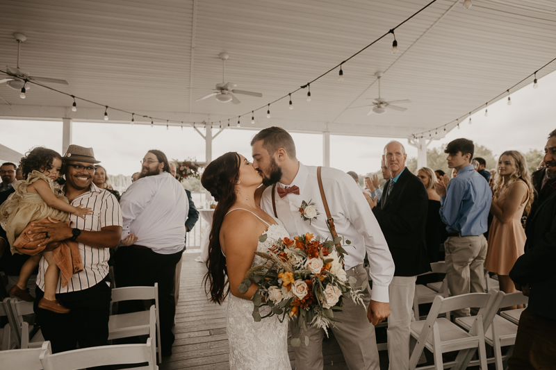 Amazing waterfront wedding ceremony at The Anchor Inn in Pasadena, Maryland by Britney Clause Photography