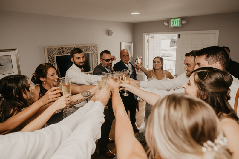 Amazing waterfront wedding ceremony at The Anchor Inn in Pasadena, Maryland by Britney Clause Photography