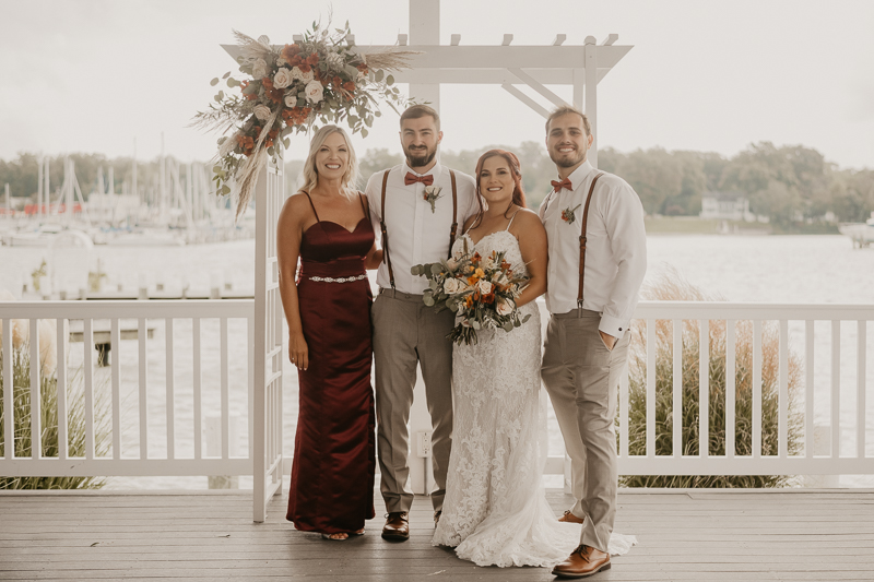 Amazing waterfront wedding ceremony at The Anchor Inn in Pasadena, Maryland by Britney Clause Photography