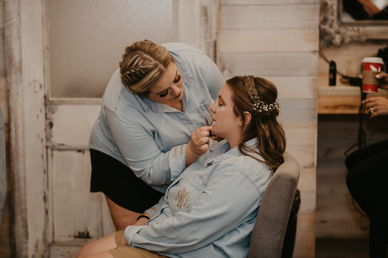 A bride getting ready for her wedding at Kylan Barn in Delmar, Maryland by Britney Clause Photography