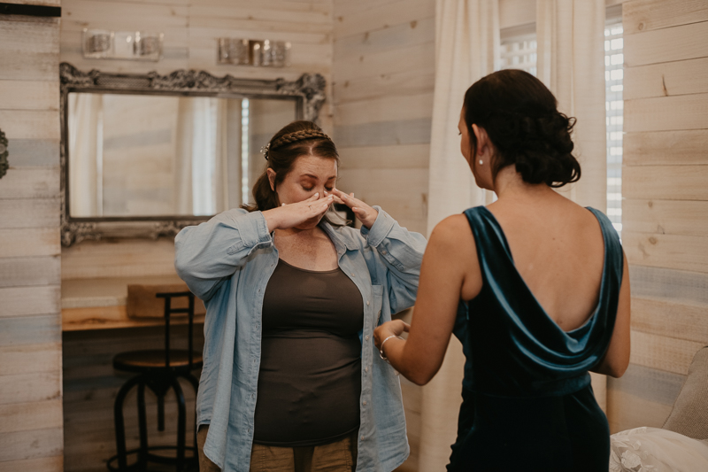 A bride getting ready for her wedding at Kylan Barn in Delmar, Maryland by Britney Clause Photography