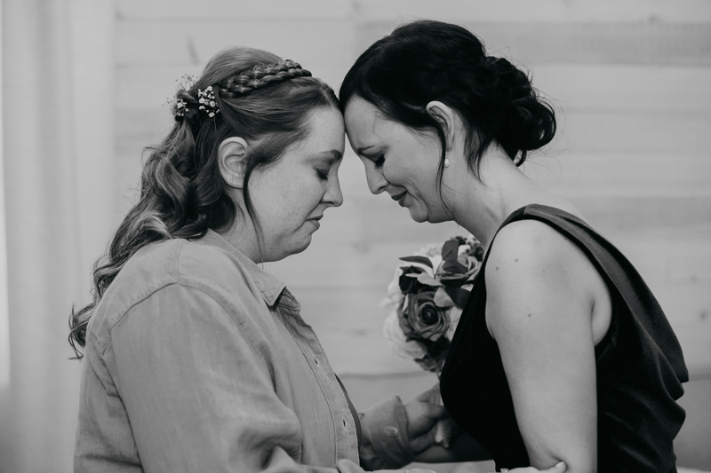 A bride getting ready for her wedding at Kylan Barn in Delmar, Maryland by Britney Clause Photography