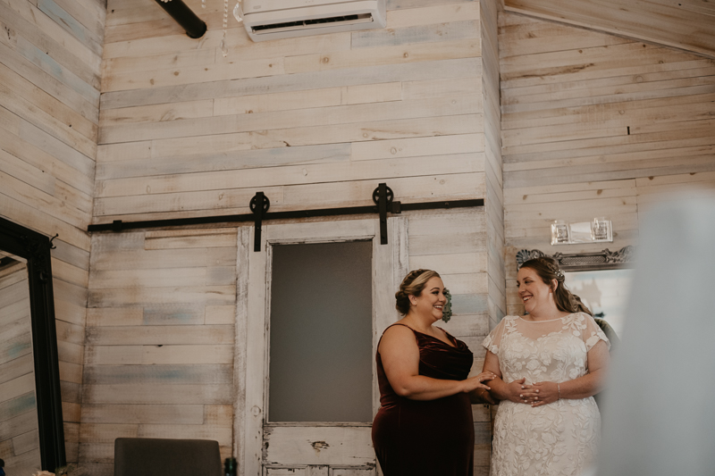 A bride getting ready for her wedding at Kylan Barn in Delmar, Maryland by Britney Clause Photography