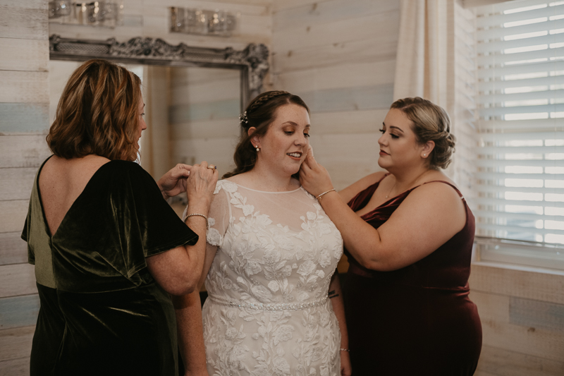 A bride getting ready for her wedding at Kylan Barn in Delmar, Maryland by Britney Clause Photography