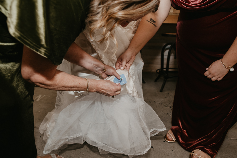 A bride getting ready for her wedding at Kylan Barn in Delmar, Maryland by Britney Clause Photography