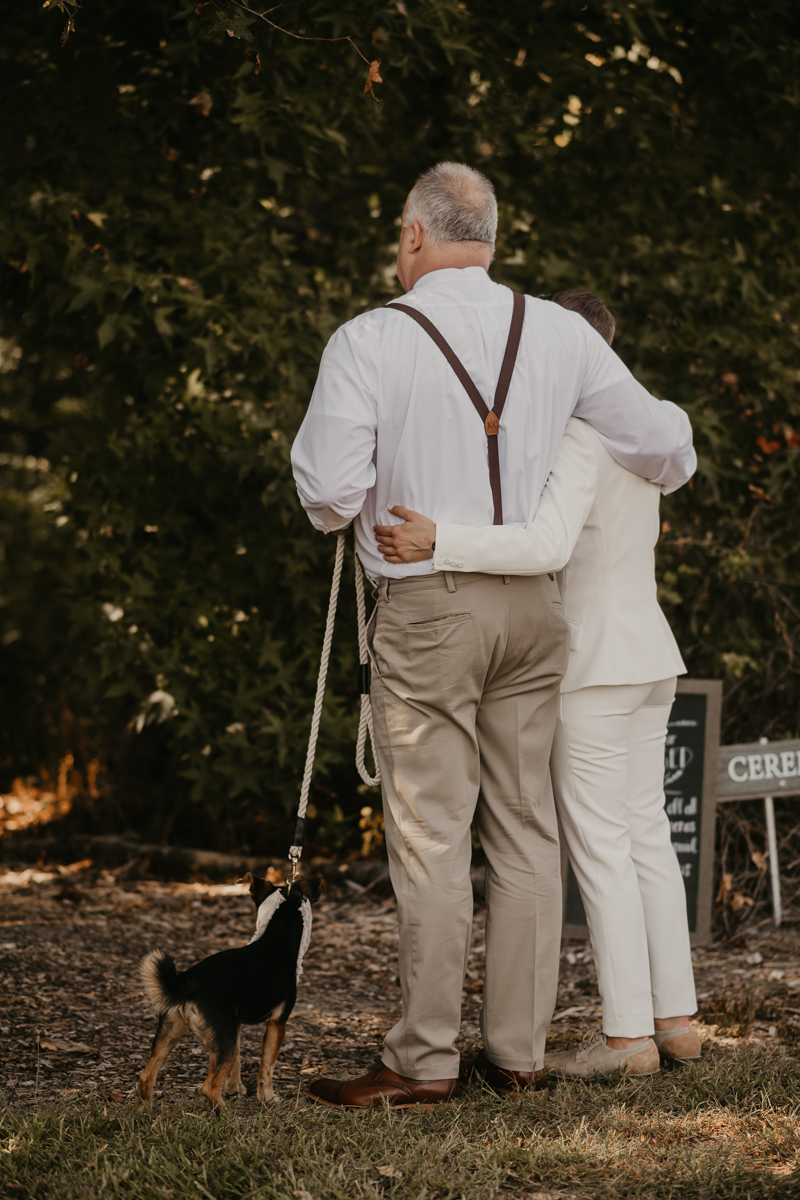 Amazing same sex wedding ceremony in the woods at Kylan Barn in Delmar, Maryland by Britney Clause Photography