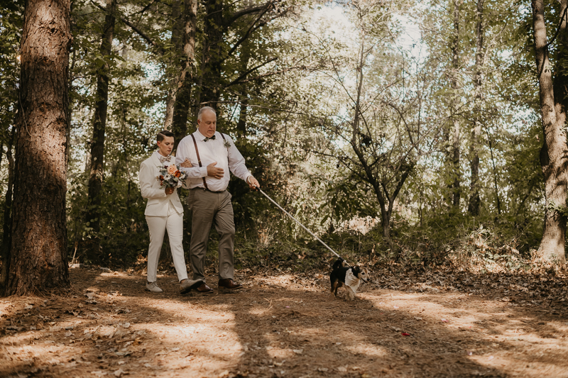 Amazing same sex wedding ceremony in the woods at Kylan Barn in Delmar, Maryland by Britney Clause Photography