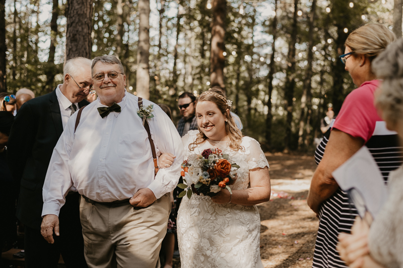 Amazing same sex wedding ceremony in the woods at Kylan Barn in Delmar, Maryland by Britney Clause Photography