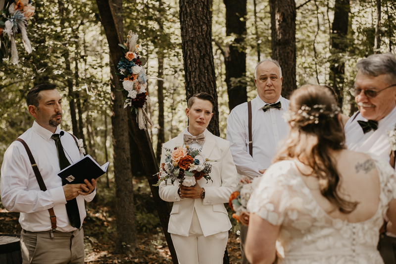 Amazing same sex wedding ceremony in the woods at Kylan Barn in Delmar, Maryland by Britney Clause Photography