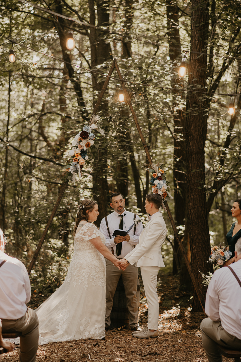 Amazing same sex wedding ceremony in the woods at Kylan Barn in Delmar, Maryland by Britney Clause Photography