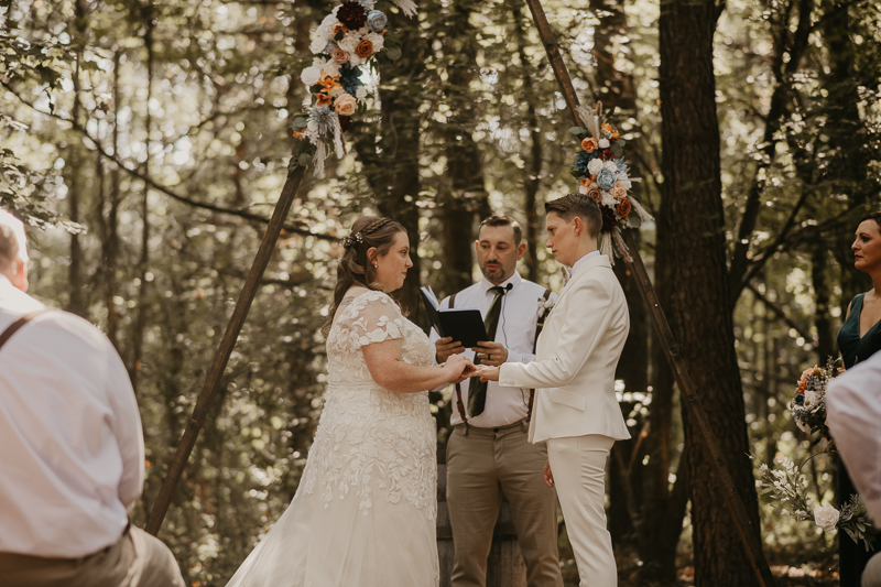 Amazing same sex wedding ceremony in the woods at Kylan Barn in Delmar, Maryland by Britney Clause Photography