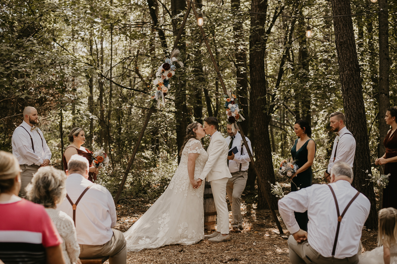 Amazing same sex wedding ceremony in the woods at Kylan Barn in Delmar, Maryland by Britney Clause Photography