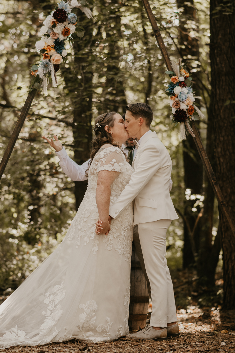 Amazing same sex wedding ceremony in the woods at Kylan Barn in Delmar, Maryland by Britney Clause Photography