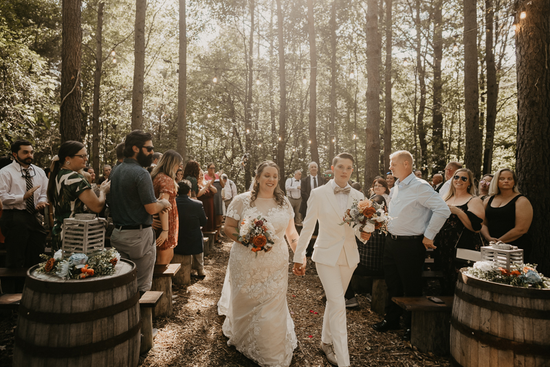 Amazing same sex wedding ceremony in the woods at Kylan Barn in Delmar, Maryland by Britney Clause Photography