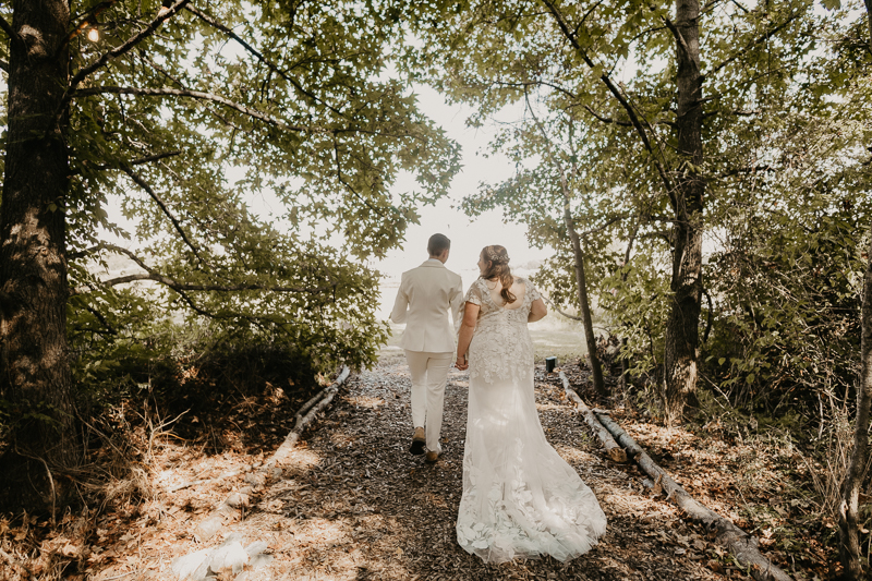 Amazing same sex wedding ceremony in the woods at Kylan Barn in Delmar, Maryland by Britney Clause Photography