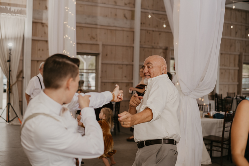 A fun wedding reception at Kylan Barn in Delmar, Maryland by Britney Clause Photography