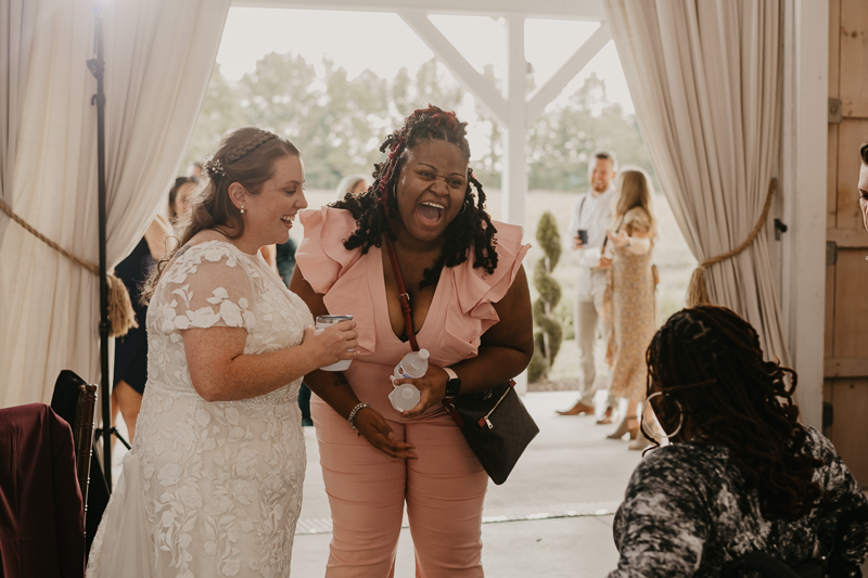 A fun wedding reception at Kylan Barn in Delmar, Maryland by Britney Clause Photography