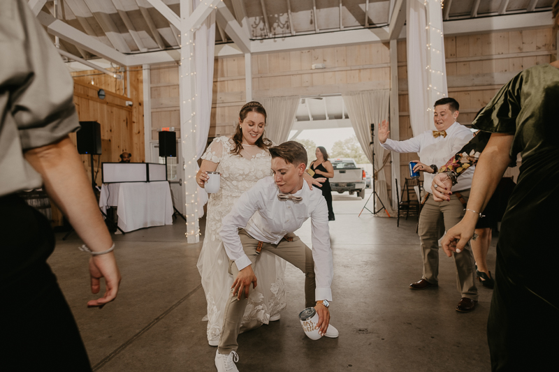 A fun wedding reception at Kylan Barn in Delmar, Maryland by Britney Clause Photography