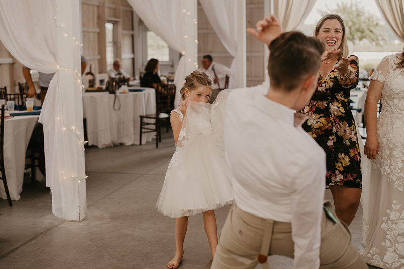 A fun wedding reception at Kylan Barn in Delmar, Maryland by Britney Clause Photography