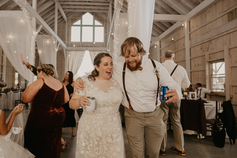 A fun wedding reception at Kylan Barn in Delmar, Maryland by Britney Clause Photography