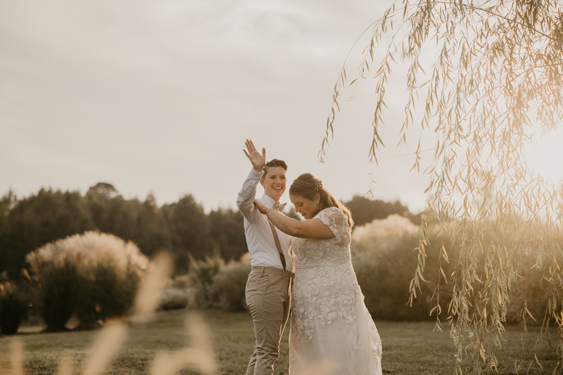 Stunning bride and bride sunset wedding portraits at Kylan Barn in Delmar, Maryland by Britney Clause Photography