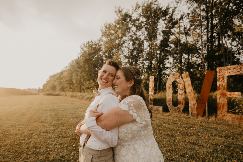 Stunning bride and bride sunset wedding portraits at Kylan Barn in Delmar, Maryland by Britney Clause Photography