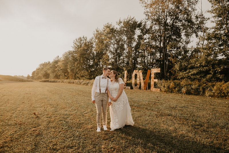 Stunning bride and bride sunset wedding portraits at Kylan Barn in Delmar, Maryland by Britney Clause Photography