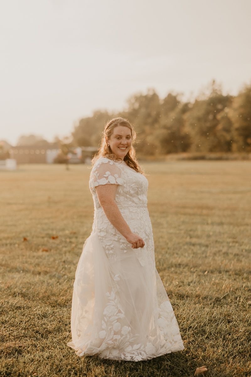 Stunning bride and bride sunset wedding portraits at Kylan Barn in Delmar, Maryland by Britney Clause Photography