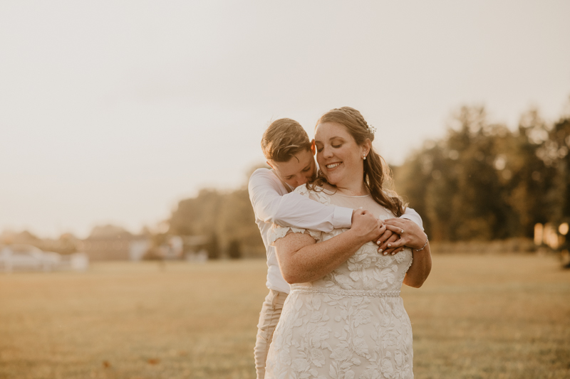 Stunning bride and bride sunset wedding portraits at Kylan Barn in Delmar, Maryland by Britney Clause Photography