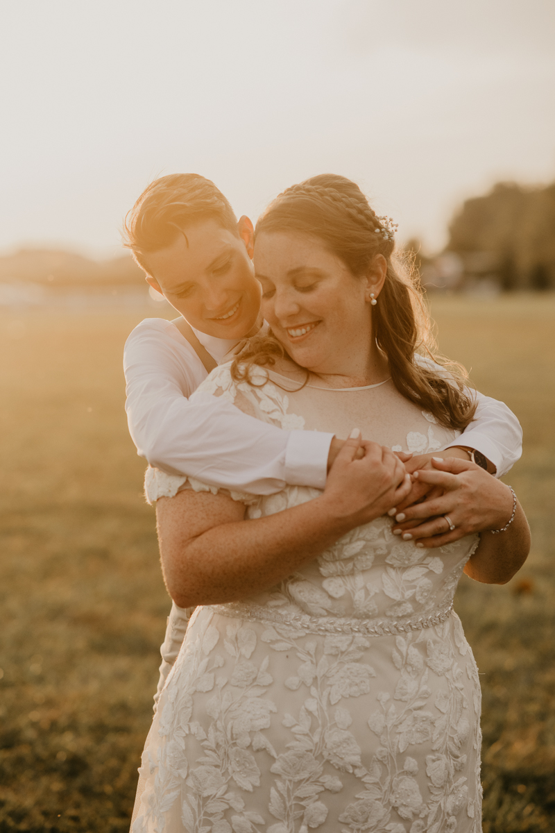 Stunning bride and bride sunset wedding portraits at Kylan Barn in Delmar, Maryland by Britney Clause Photography