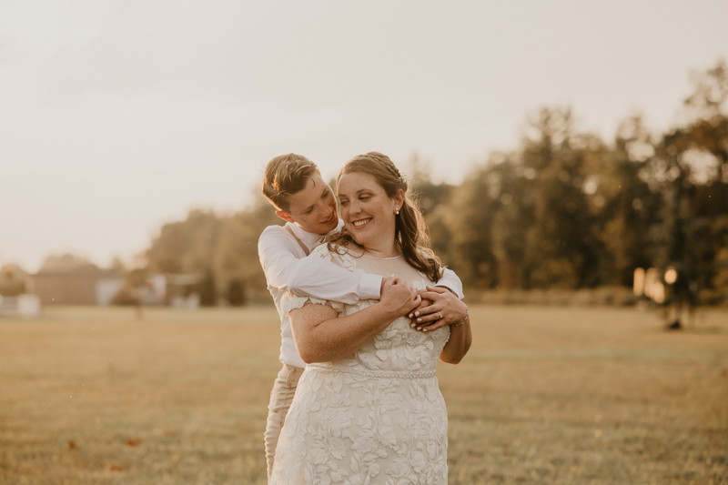 Stunning bride and bride sunset wedding portraits at Kylan Barn in Delmar, Maryland by Britney Clause Photography