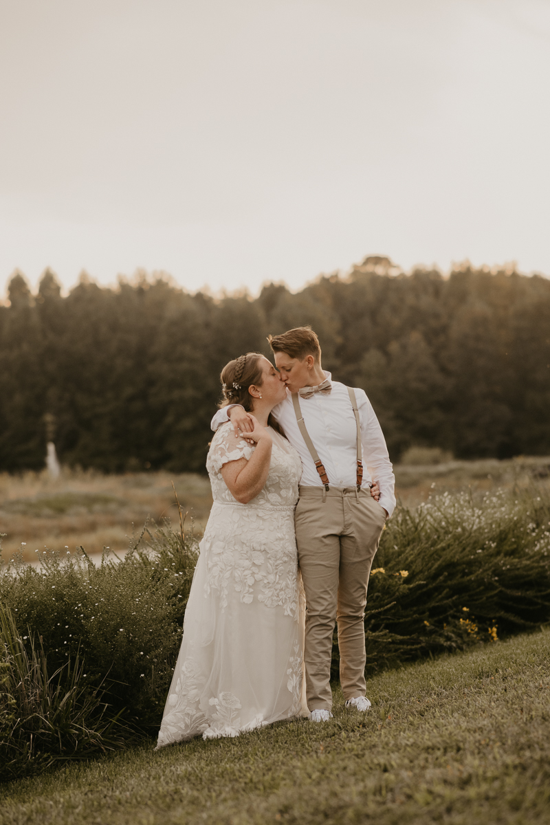 Stunning bride and bride sunset wedding portraits at Kylan Barn in Delmar, Maryland by Britney Clause Photography