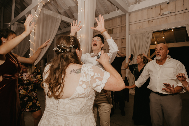 A fun wedding reception at Kylan Barn in Delmar, Maryland by Britney Clause Photography