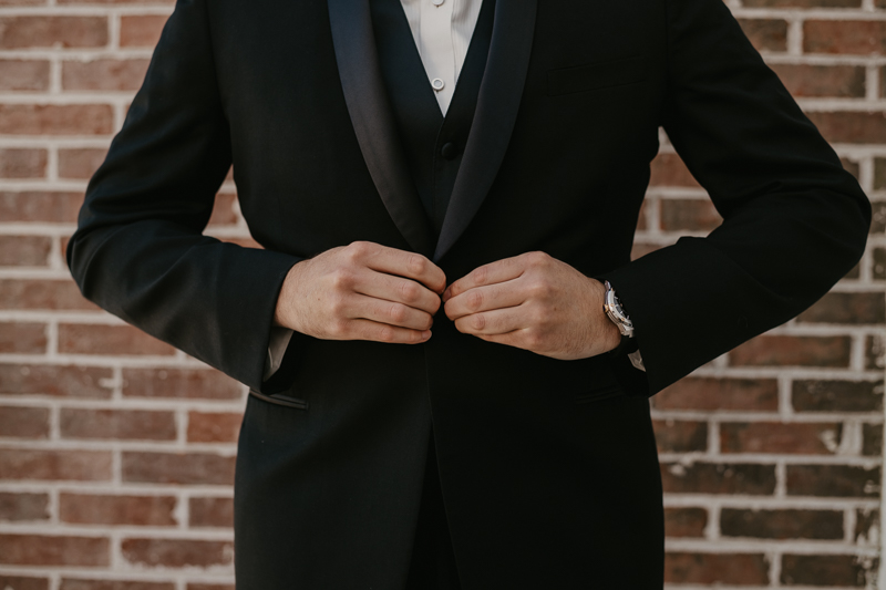 A groom getting ready for his wedding at The Hyatt Regency Chesapeake Bay, Maryland by Britney Clause Photography