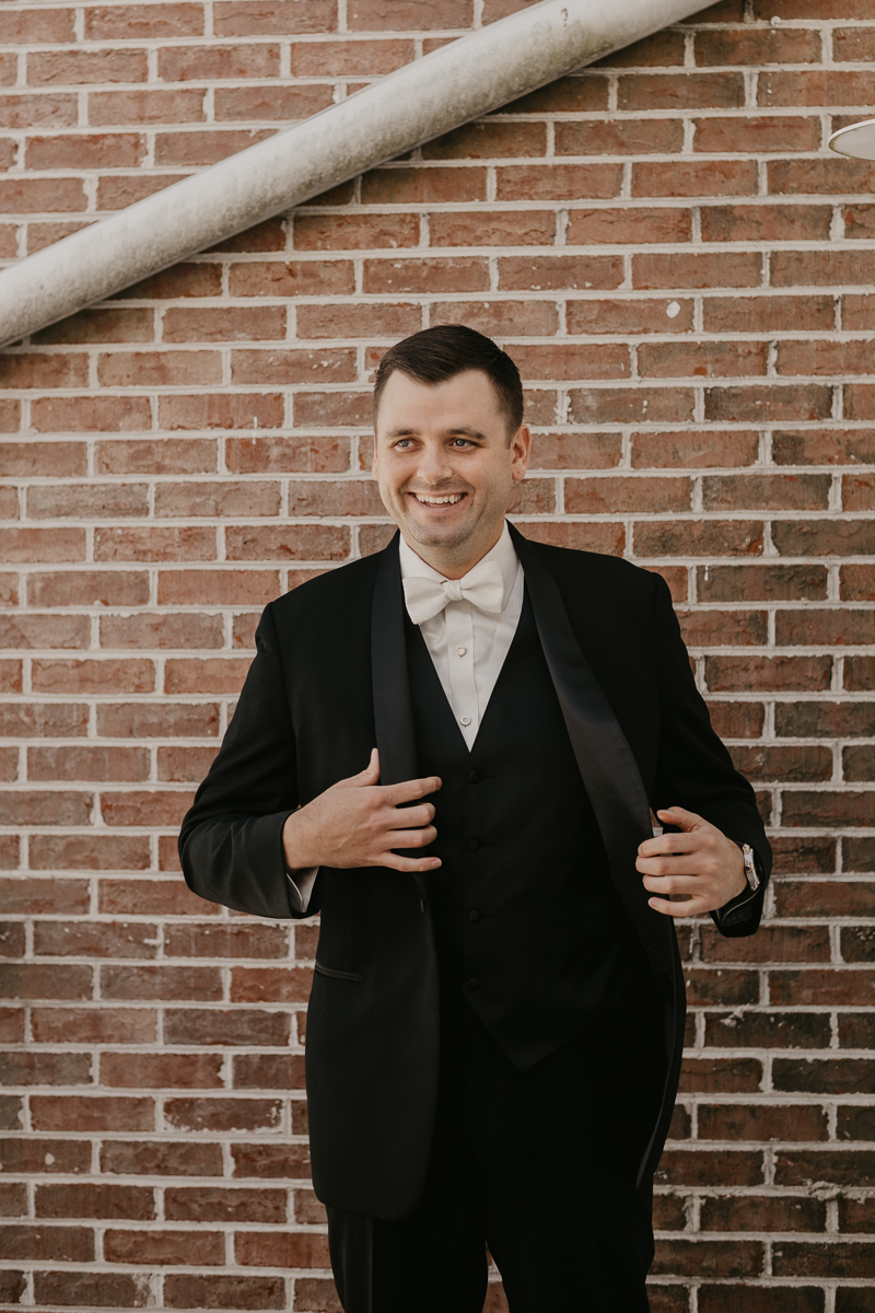 A groom getting ready for his wedding at The Hyatt Regency Chesapeake Bay, Maryland by Britney Clause Photography