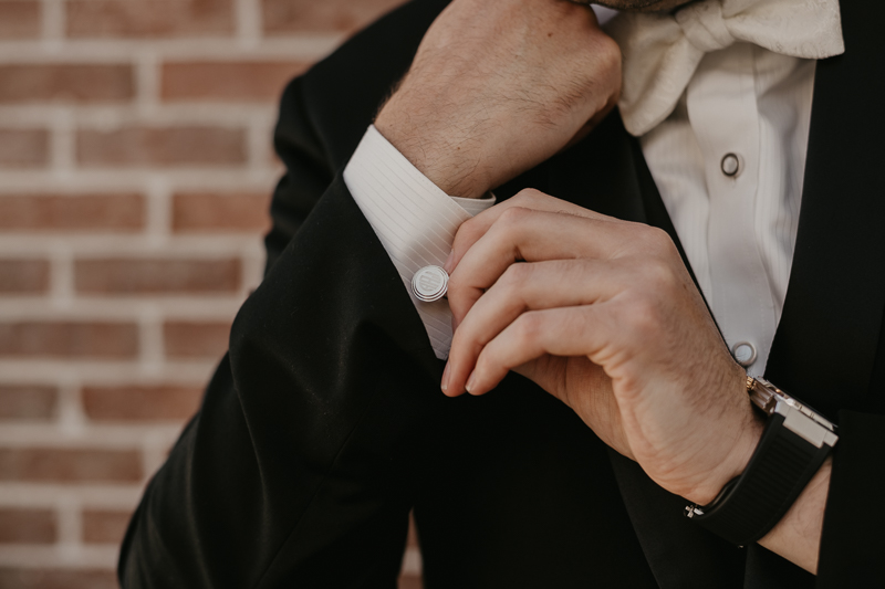 A groom getting ready for his wedding at The Hyatt Regency Chesapeake Bay, Maryland by Britney Clause Photography